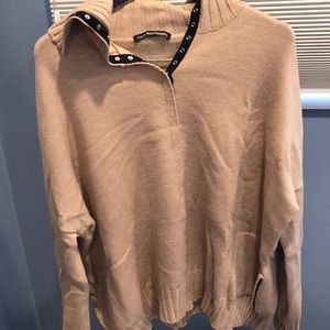 Buckle up tan sweater